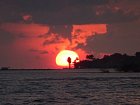 Maledivy - zapad slunce and atolem